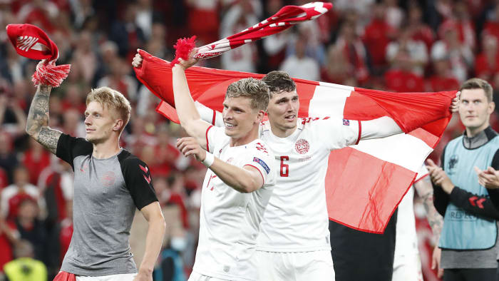Denmark players celebrate a win over Russia.